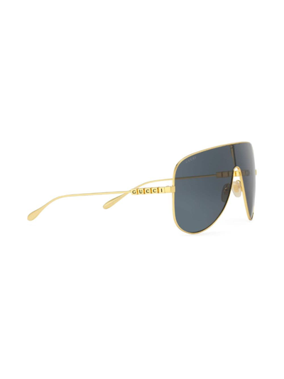 Shop Gucci Mask Logo-lettering Sunglasses In Gold