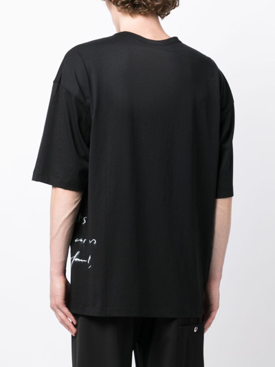 Shop Ann Demeulemeester Text-print Cotton T-shirt In Black