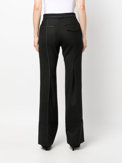 Shop Victoria Beckham Contrast-stitching Flared Trousers In Black