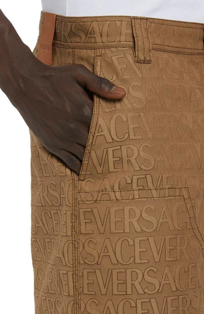 Shop Versace Allover Logo Jacquard Techno Canvas Shorts In Brown Beige