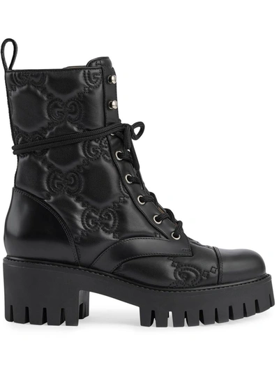 Shop Gucci Gg Matelassé Leather Boots In Black