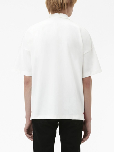 Shop Jw Anderson Graphic-print Cotton Polo Shirt In White