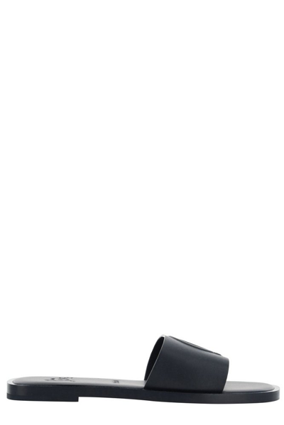 Shop Christian Louboutin Logo Embossed Slip In Black