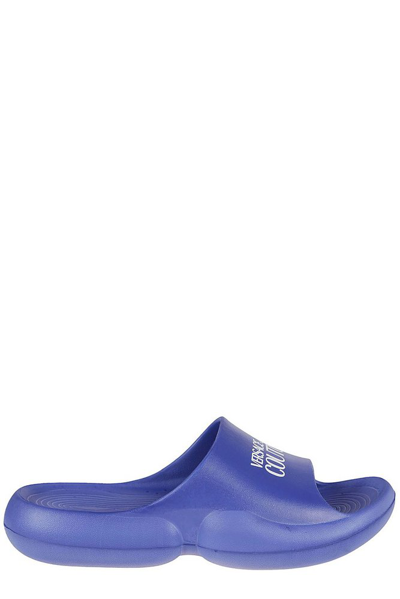 Shop Versace Jeans Couture Logo Printed Round Toe Slides In Blue