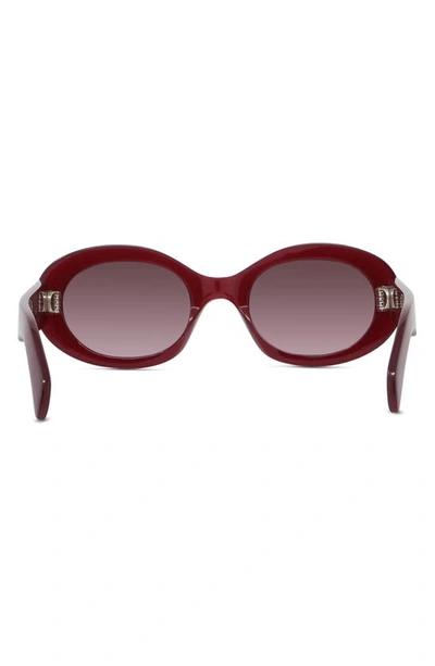 Shop Celine Triomphe 52mm Oval Sunglasses In Shiny / Gradient Bordeaux