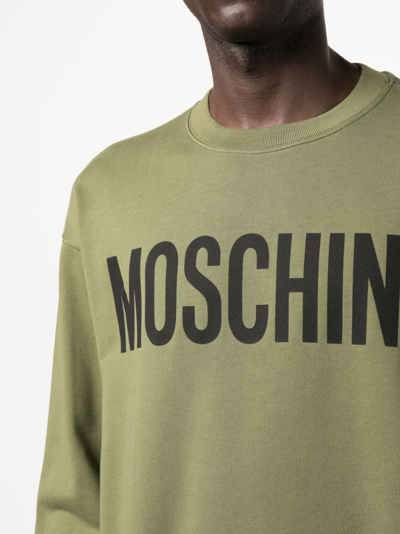 Shop Moschino Logo-print Crew-neck Sweatshirt In Grün