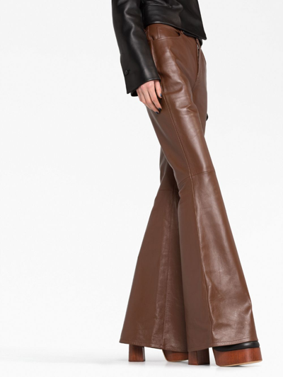 Shop Chloé Flared Leather Trousers In Brown
