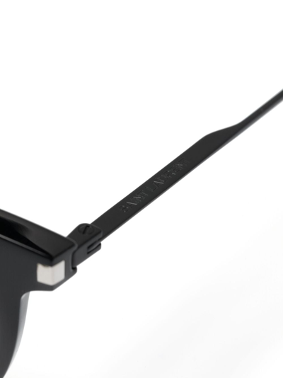 Shop Saint Laurent Engraved-logo Round-frame Glasses In Schwarz