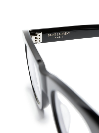 Shop Saint Laurent Logo-engraved Round-frame Glasses In Black