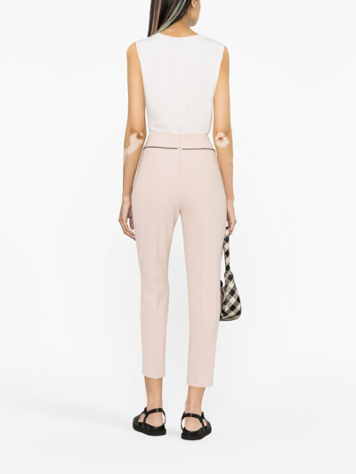 Shop Liu •jo Button-embellished Cropped Trousers In Pink