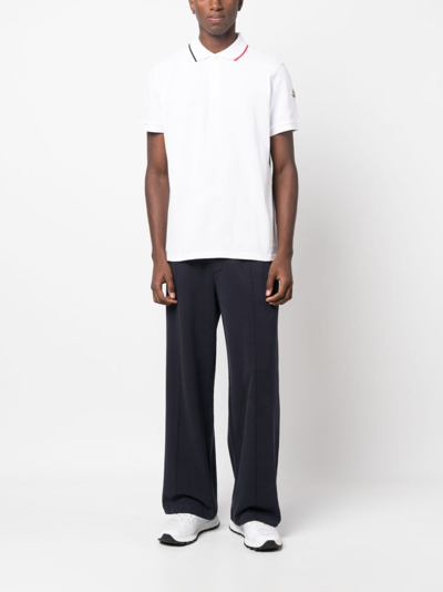 Shop Moncler Logo-appliqué Cotton Polo Shirt In Weiss