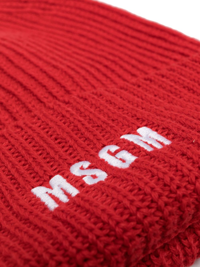 Shop Msgm Logo-embroidered Knitted Beanie In Red