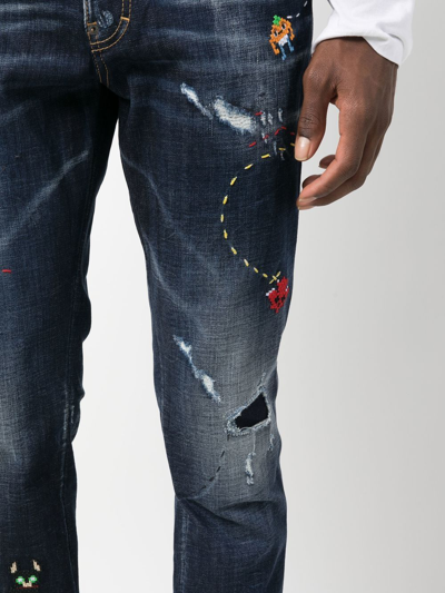 Shop Dsquared2 Illustrated Distressed Skinny Jeans In Blue