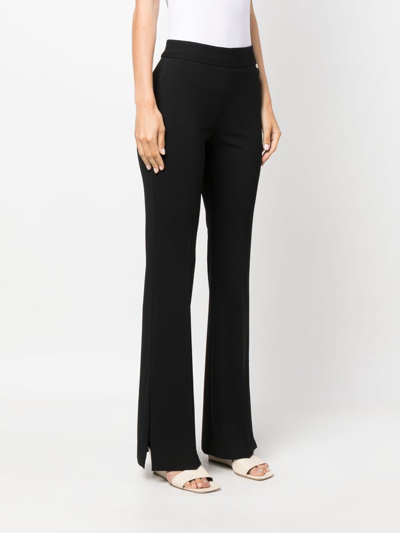 Shop Liu •jo High-waisted Flared Trousers In Black