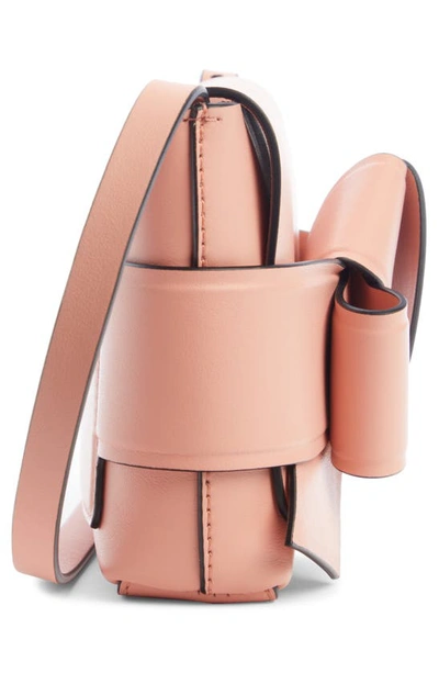 Shop Acne Studios Musubi Bow Detail Crossbody Bag In Salmon Pink