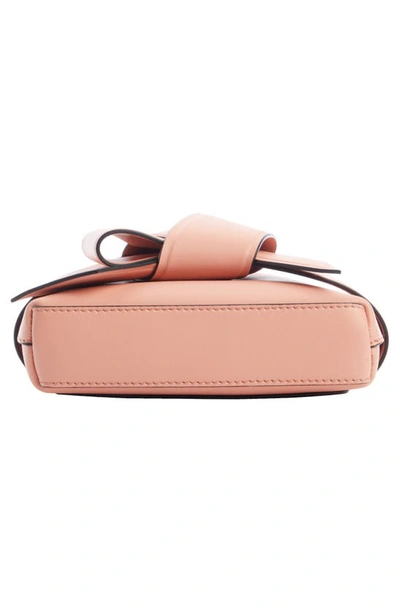 Shop Acne Studios Musubi Bow Detail Crossbody Bag In Salmon Pink