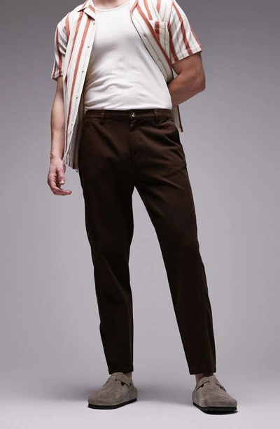 Shop Topman Twisted Seam Tapered Trousers In Brown