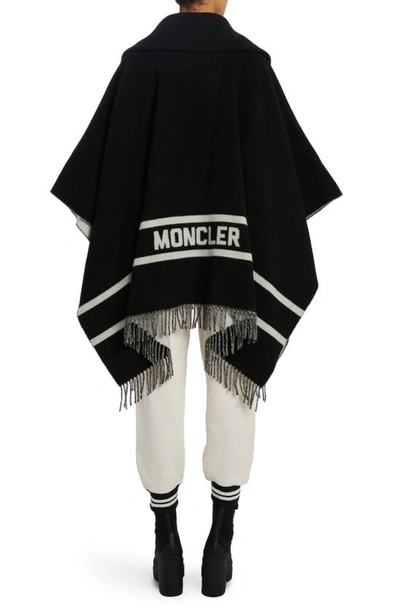 Shop Moncler Fringe Wool Blend Cape In Black