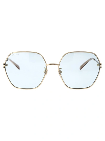 Shop Gucci Sunglasses In 004 Gold Gold Light Blue