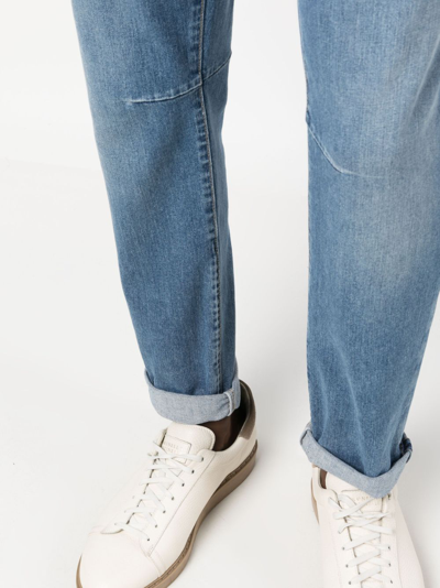 Shop Brunello Cucinelli Low-rise Tapered-leg Jeans In Blue