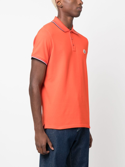 Shop Moncler Logo-patch Striped Cotton Polo Shirt In Orange