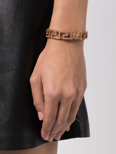 Shop Versace Greca Tribute Medusa Cuff Bracelet In Gold