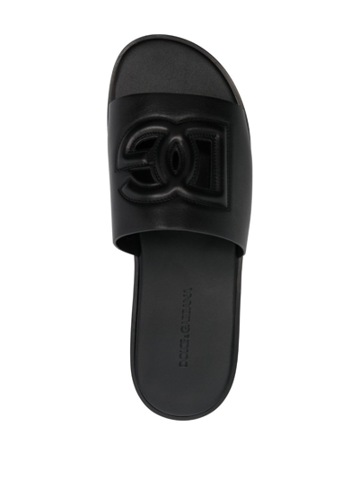 Shop Dolce & Gabbana Embossed-logo Leather Slides In Schwarz