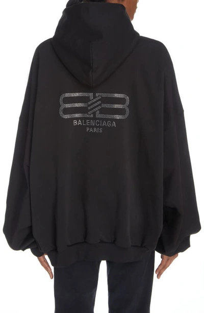 Shop Balenciaga Gender Inclusive Beaded Back Logo Oversize Hoodie In Washed Black