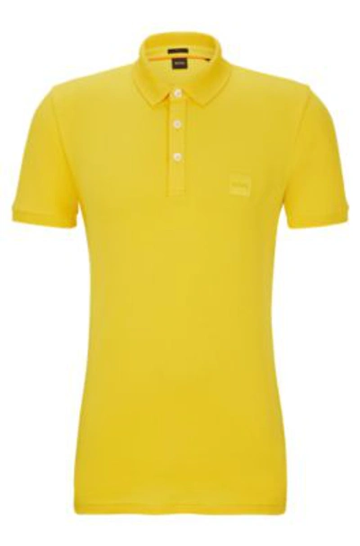 Shop Hugo Boss Stretch-cotton Slim-fit Polo Shirt With Logo Patch In Light Yellow