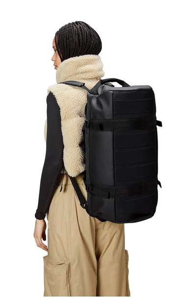 Shop Rains Small Texel Waterproof Duffle Backpack In Black