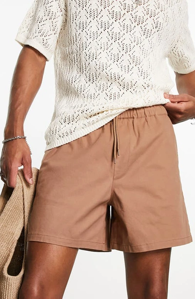 Shop Asos Design Elastic Waist Wide Leg Chino Shorts In Tan