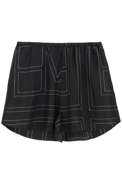 Shop Totême Monogram-embroidered Pajama Shorts In Beige,black