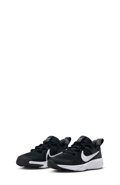 Shop Nike Kids' Star Runner 4 Sneaker In Black/ White/ Anthracite