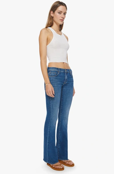 Shop Mother The Down Low Heel Low Rise Flare Jeans In Right On