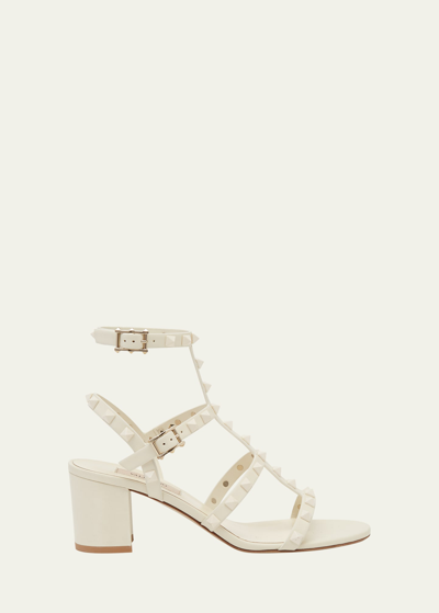 Shop Valentino Rockstud Dual-strap Caged Sandals In 098 Ivory