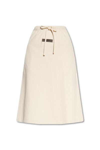 Shop Essentials Fear Of God  Logo Patch Drawstring Midi Skirt In Beige