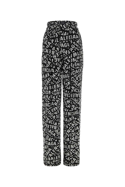 Shop Balenciaga Allover Logo Printed Pants In Multi