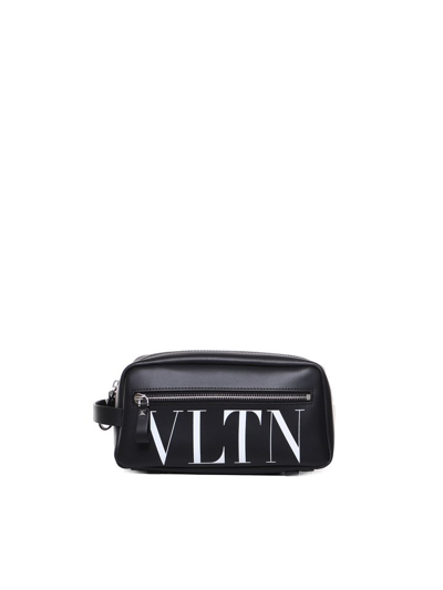 Shop Valentino Vltn Logo Printed Clutch Bag In Black