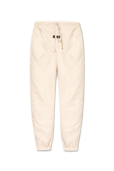 Shop Essentials Fear Of God  Logo Patch Drawstring Track Pants In Beige