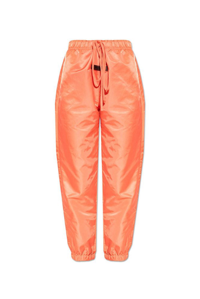 Shop Essentials Fear Of God  Logo Patch Track Pants In Orange