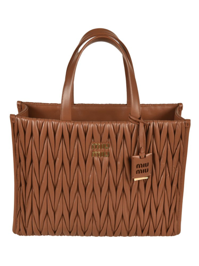 Shop Miu Miu Logo Plaque Tote Bag In Brown