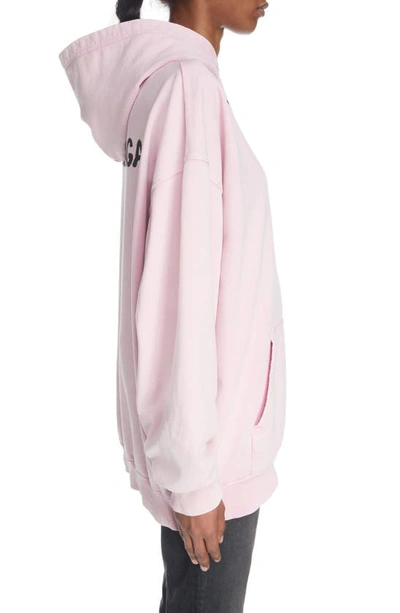Shop Balenciaga Medium Fit Logo Graphic Hoodie In Faded Pink/ Black