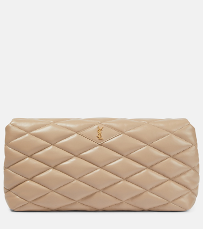 Shop Saint Laurent Sade Puffer Quilted Leather Clutch In Beige