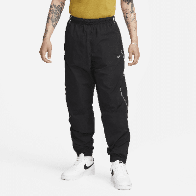 Shop Nike Men's Solo Swoosh Track Pants In Black