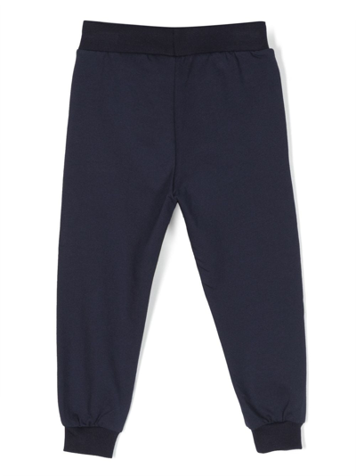 Shop Moschino Logo-print Stretch-cotton Track Pants In Blue