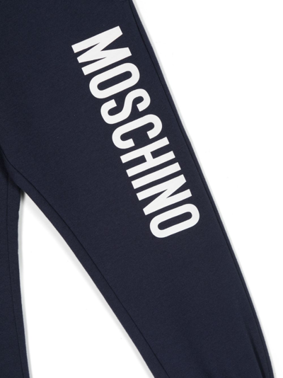 Shop Moschino Logo-print Stretch-cotton Track Pants In Blue