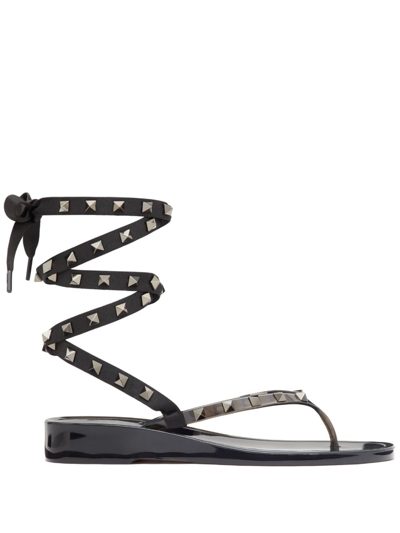 Shop Valentino Rockstud Flat Lace-up Thong Sandals In Black