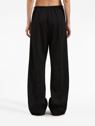 Shop Palm Angels Stripe-detail Loose-fit Track Pants In Black