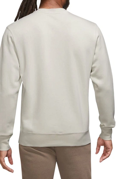 Shop Nike Fleece Graphic Pullover Sweatshirt In Light Bone/ Black