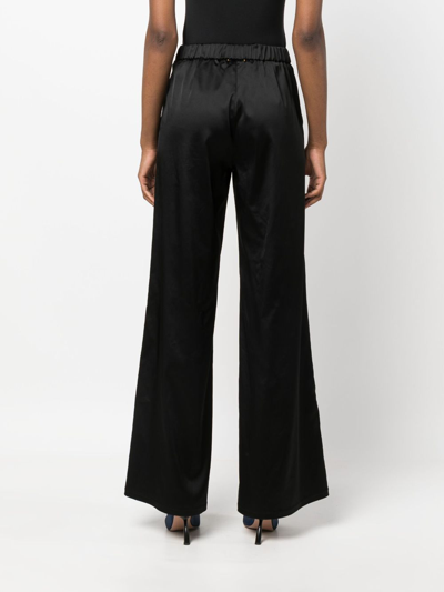 Shop Forte Forte Mid-rise Satin Flared Trousers In Black